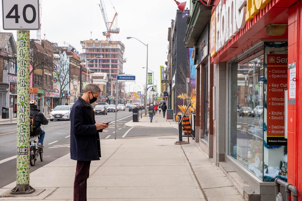 Canada lockdown people wearing masks on near empty streets toronto ontario canada